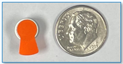 Size 13 Battery with Orange tab next to a dime