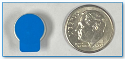 Size 675 Battery with Blue tab next to a dime