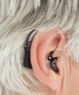 Product model Digital Hearing Aids Set - Premium Rechargeable Behind The Ear Personal Sound Amplification Device in Use